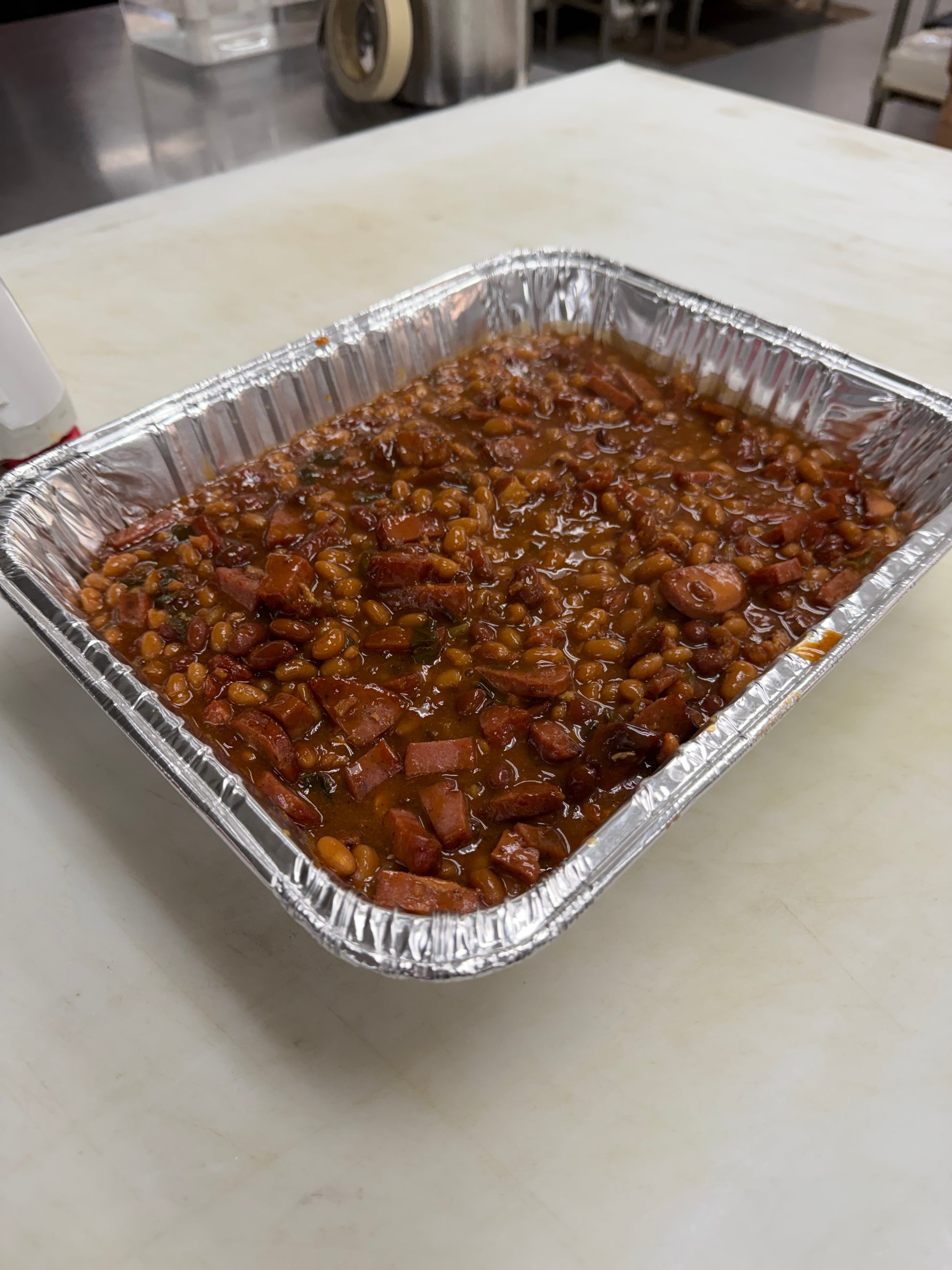 close up of baked beans in a tray